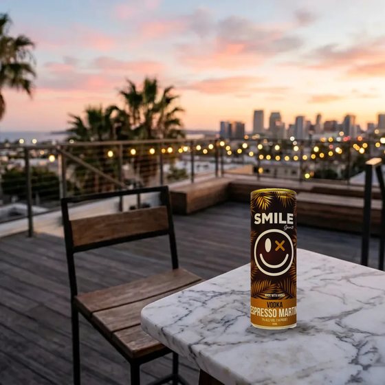 Smile Vodka Espresso Martini can on a San Diego rooftop at dusk