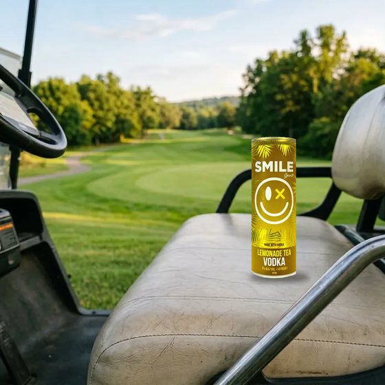 Smile Lemonade Tea Vodka can on a golf cart